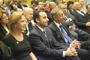 Kathryn Porter, Vardan Barseghian and Mark Geragos listen to congressional speakers.