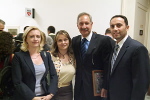 Sarah Ludwig (L) Executive Director of Americans for Artsakh, Mark Geragos and Rep. Barseghian pose for picture with event participants.